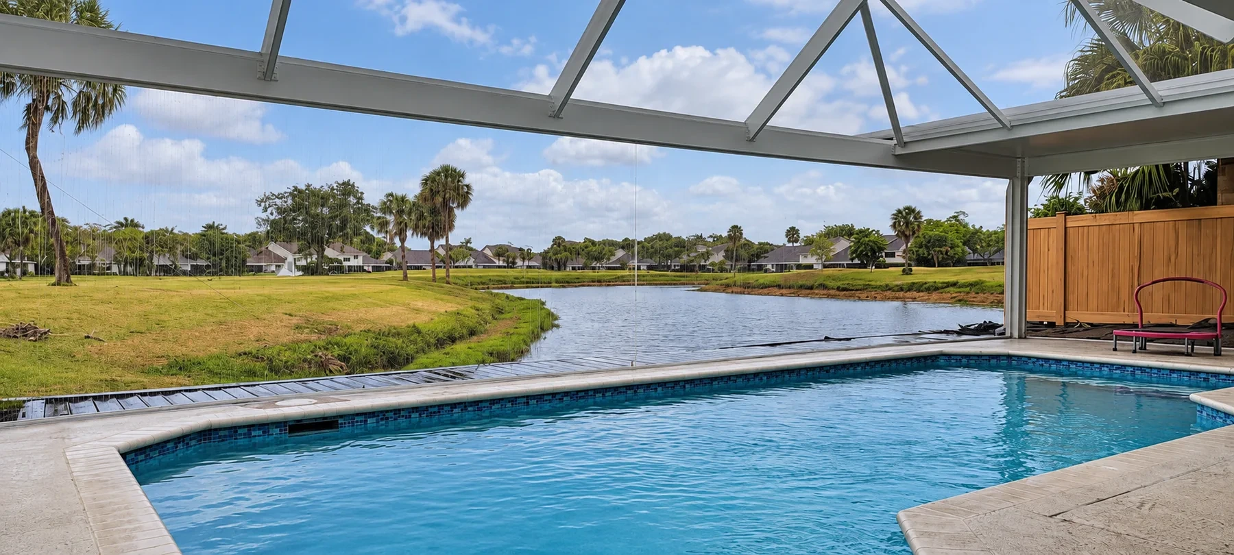 Picture-view pool enclosure overlooking a lake